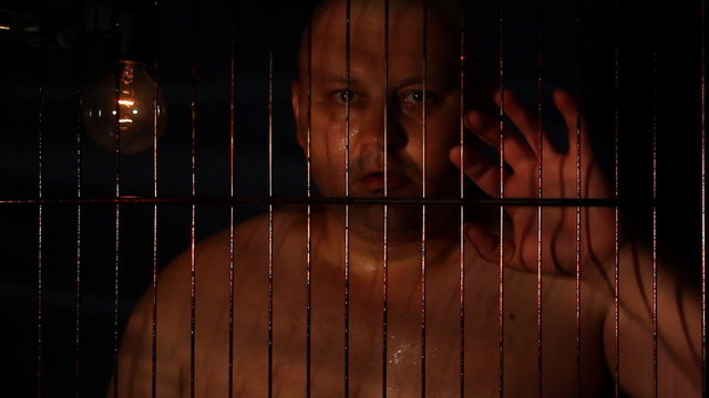 Prisoner in jail cell