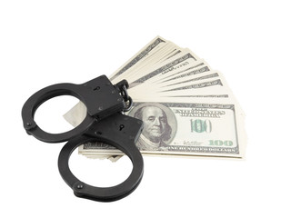 Stack of money and handcuffs isolated