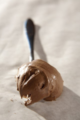 Delicious creamy chocolate mousse on a spoon