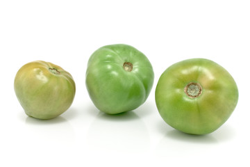 Three green tomatoes