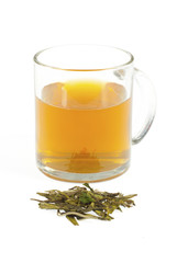 tea in glass cup and leaves