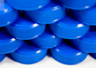 Plastic Bottle caps in a row