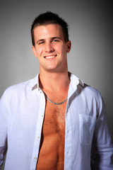 Obraz premium Handsome man casually against the wall