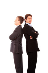 Two business men standing back to back