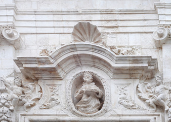 Baroque tympanum in Monopoli, Italy