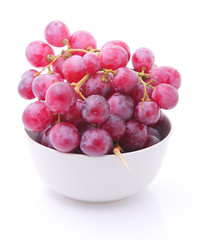 Image of red grape in bowl isolated on white