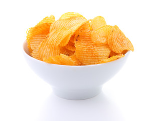 Potato chips in white bowl isolated