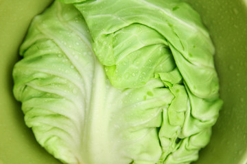 Image of white cabbage in a deep plate closeup