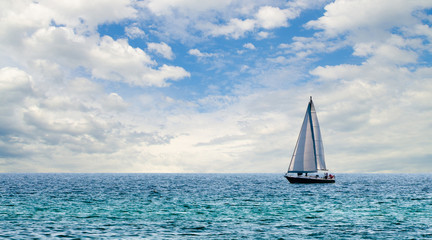 Sailboat on light blue water off Florida Gulf Coast