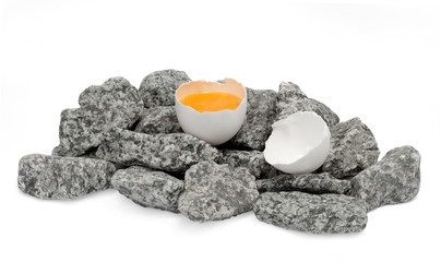 Broken egg on stones