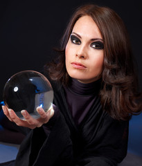 Young woman with crystal ball.