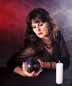 Young woman  with crystal ball.