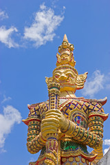 Fototapeta na wymiar Golden giant with golden dress, Thailand
