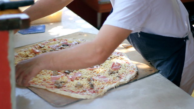 Chef Making Pizza in Commercial Kitchen