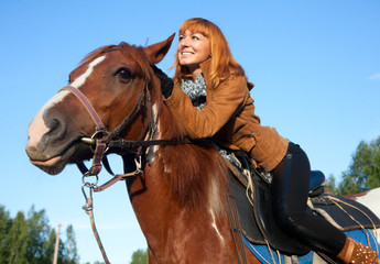 Fototapeta premium Woman on the red horse