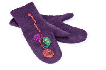 Violet felt mittens over white background