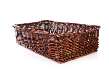 Obraz premium Big empty cane basket over white background