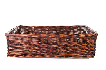 Big empty cane basket over white background
