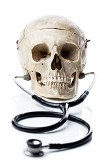 Human skull with a stethoscope.