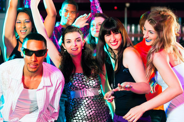 Disco party people dancing in a club