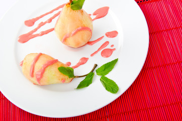 Dessert with pear in sauce