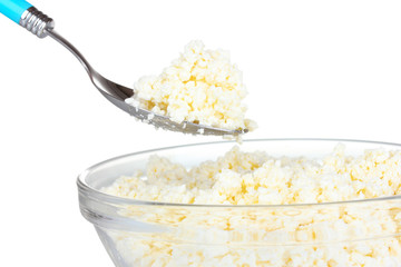 Tasty cottage cheese in bowl isolated on white