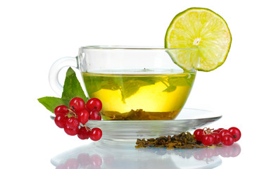 green tea in transparent cup with lime and berry