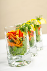 Tasty salad served in glasses