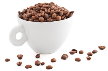 white cup with coffee beans isolated