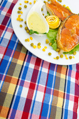 Roasted salmon in the plate