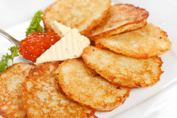 fried potatoes pancakes with caviar