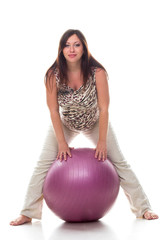 Pregnant woman excercises with gymnastic ball