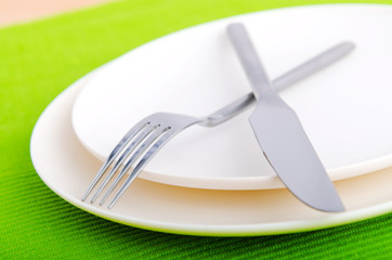 Empty plate with utensils
