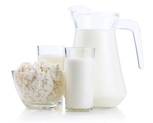 Cup serving of Cottage Cheese, two glasses and Jug of fresh milk