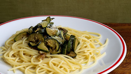 spaghetti and zucchini on a table