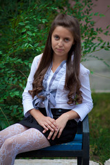 teen sitting on the bench