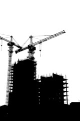 Silhouettes of two elevating cranes on background of buildings