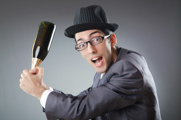 Naklejka premium Businessman with bottle of champagne