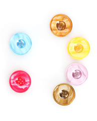 Bright sewing buttons isolated on white
