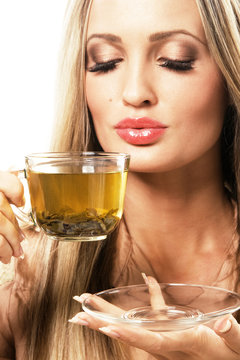 Beautiful woman with a cup of green tea
