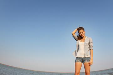 young attractive woman on sea background