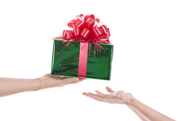 Hands giving and receiving a present
