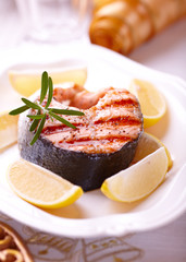 Grilled salmon steak with lemons for Christmas