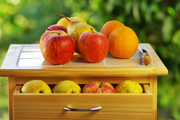 Fruits and knife on table.
