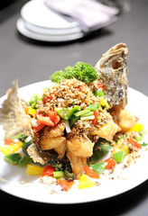 Herb salad with fried fish