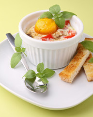 baked egg with toast and basil