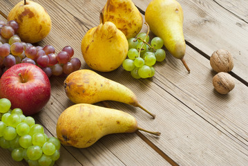 apples grapes and pears, wooden table