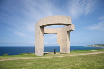 woman at monument in Gijon © Q