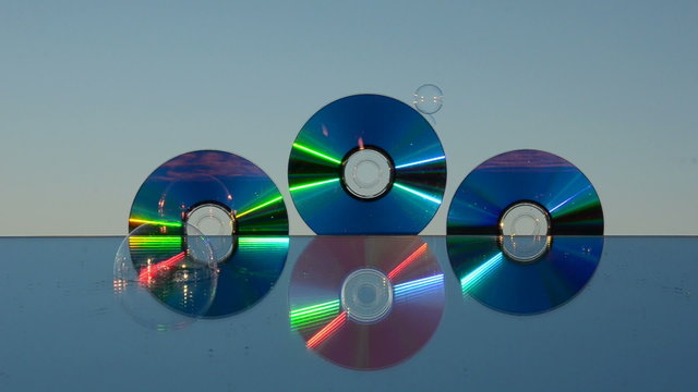 dvd discs on mirror and soap bubbles