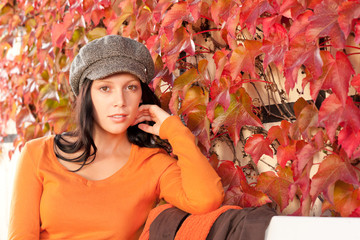 Autumn park bench young woman relaxing
